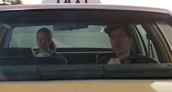 Movie still from “Safe” (1995), directed by Todd Haynes – A man and a woman in the back seat of a taxi; Medium shot, Low angle