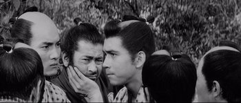Movie still from “Sanjuro” (1962), directed by Akira Kurosawa – A group of men standing next to each other; Close Up shot, Low angle