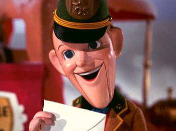 Movie still from “Santa Claus Is Comin' to Town” (1970), directed by Jules Bass – A character holding an envelope; Close Up shot, Low angle