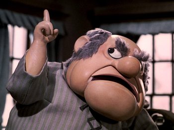 Movie still from “Santa Claus Is Comin' to Town” (1970), directed by Jules Bass – The head of a cartoon character; Medium shot, Low angle