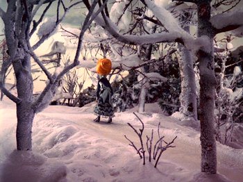 Movie still from “Santa Claus Is Comin' to Town” (1970), directed by Jules Bass – A fire hydrant in the middle of a snow covered forest; Wide shot, High angle