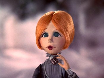 Movie still from “Santa Claus Is Comin' to Town” (1970), directed by Jules Bass – A doll's face with a red hair; Close Up shot, Low angle