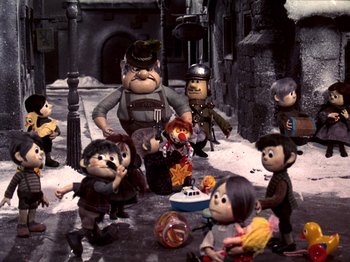 Movie still from “Santa Claus Is Comin' to Town” (1970), directed by Jules Bass – A group of people standing next to each other in front of a fire hydrant; Wide shot, High angle