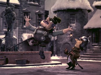 Movie still from “Santa Claus Is Comin' to Town” (1970), directed by Jules Bass – Two animated characters are fighting in the snow; Wide shot, Low angle