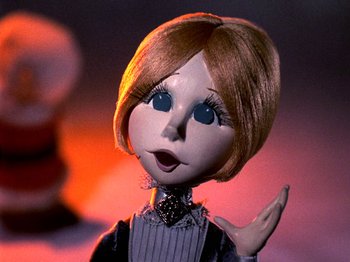 Movie still from “Santa Claus Is Comin' to Town” (1970), directed by Jules Bass – A doll's face with a surprised look on her face; Close Up shot, Low angle
