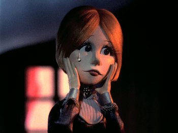 Movie still from “Santa Claus Is Comin' to Town” (1970), directed by Jules Bass – A doll that has a tear on its face; Close Up shot, Low angle