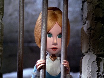 Movie still from “Santa Claus Is Comin' to Town” (1970), directed by Jules Bass – A doll is behind bars in a room; Close Up shot, Low angle