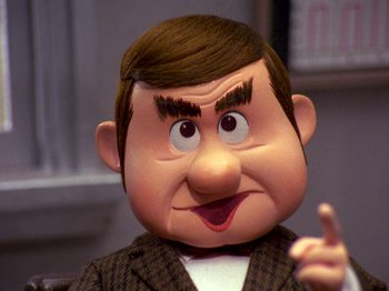 Movie still from “Santa Claus Is Comin' to Town” (1970), directed by Jules Bass – The face of a toy character; Close Up shot, High angle