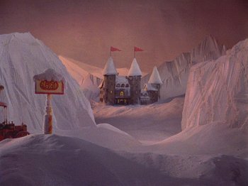 Movie still from “Santa Claus Is Comin' to Town” (1970), directed by Jules Bass – An animated scene of a castle in the middle of a snowy field; Extreme Wide shot, High angle