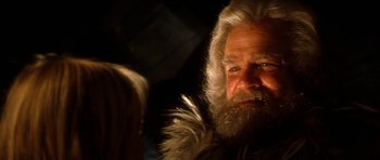 Movie still from “Santa Claus” (1985), directed by Jeannot Szwarc – An old man with a long white beard; Close Up shot, Over the shoulder angle