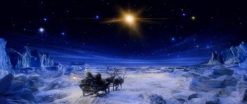 Movie still from “Santa Claus” (1985), directed by Jeannot Szwarc – A reindeer pulling a sleigh in the snow at night; Extreme Wide shot, High angle
