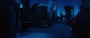 Movie still from “Santa Claus” (1985), directed by Jeannot Szwarc – A view of a city at night from the ground; Extreme Wide shot, High angle