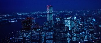 Movie still from “Santa Claus” (1985), directed by Jeannot Szwarc – A view of a city at night from a helicopter; Extreme Wide shot, Low angle