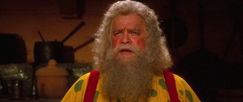 Movie still from “Santa Claus” (1985), directed by Jeannot Szwarc – An old man with a long white beard; Close Up shot, Low angle