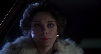 Movie still from “Saturday Night Fever” (1977), directed by John Badham – A person wearing a white jacket; Close Up shot, High angle