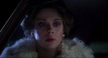Movie still from “Saturday Night Fever” (1977), directed by John Badham – A person wearing a dress; Close Up shot, Over the shoulder angle