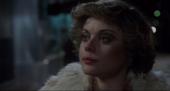 Movie still from “Saturday Night Fever” (1977), directed by John Badham – A person wearing a fur coat; Close Up shot, Over the shoulder angle