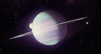 Movie still from “Saturn 3” (1980), directed by John Barry – An image of an alien planet in space; Extreme Wide shot, Overhead angle