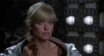 Movie still from “Saturn 3” (1980), directed by John Barry – A person wearing a jacket; Close Up shot, Over the shoulder angle