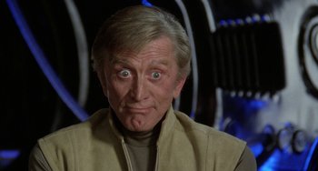 Movie still from “Saturn 3” (1980), directed by John Barry – An older man with a surprised look on his face; Close Up shot, Low angle