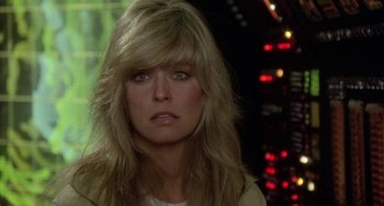 Movie still from “Saturn 3” (1980), directed by John Barry – A person with long blonde hair; Close Up shot, Over the shoulder angle