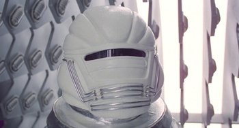Movie still from “Saturn 3” (1980), directed by John Barry – A white helmet on top of a helmet stand; Close Up shot, Low angle