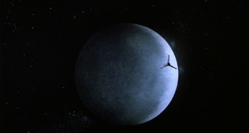 Movie still from “Saturn 3” (1980), directed by John Barry – A view of the moon with a clock in the middle of it; Extreme Wide shot, Low angle