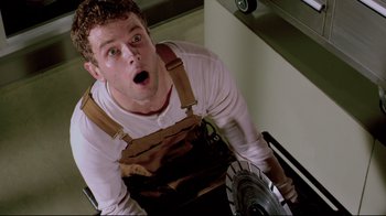 Movie still from “Saw 3D” (2010), directed by Kevin Greutert – A man with a surprised look on his face; Close Up shot, Low angle