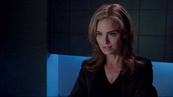 Movie still from “Saw 3D” (2010), directed by Kevin Greutert – A woman in a black shirt and a black jacket; Close Up shot, Over the shoulder angle