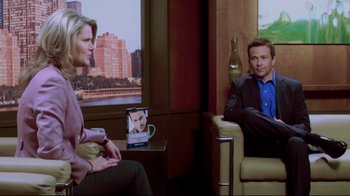 Movie still from “Saw 3D” (2010), directed by Kevin Greutert – A man and a woman sitting in a chair talking; Medium shot, Over the shoulder angle