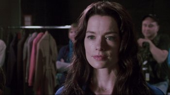 Movie still from “Saw 3D” (2010), directed by Kevin Greutert – A person with long brown hair; Close Up shot, Over the shoulder angle