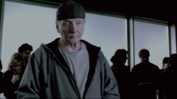 Movie still from “Saw 3D” (2010), directed by Kevin Greutert – An older man wearing a hat and a jacket; Close Up shot, Low angle