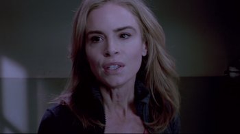 Movie still from “Saw 3D” (2010), directed by Kevin Greutert – A person with long blonde hair; Close Up shot, Over the shoulder angle
