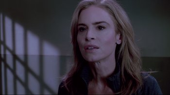 Movie still from “Saw 3D” (2010), directed by Kevin Greutert – A person with long blonde hair; Close Up shot, Over the shoulder angle