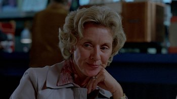 Movie still from “Scanners” (1981), directed by David Cronenberg – An older woman sitting in front of a window; Close Up shot, Over the shoulder angle