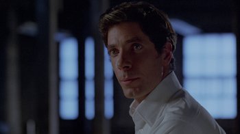 Movie still from “Scanners” (1981), directed by David Cronenberg – A man wearing a white shirt; Close Up shot, Over the shoulder angle