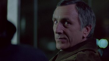 Movie still from “Scanners” (1981), directed by David Cronenberg – A person looking at the camera; Close Up shot, Over the shoulder angle