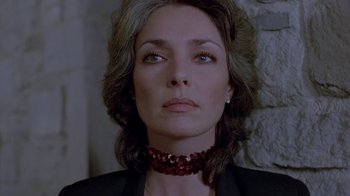 Movie still from “Scanners” (1981), directed by David Cronenberg – A person wearing a necklace; Close Up shot, Low angle
