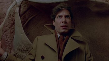 Movie still from “Scanners” (1981), directed by David Cronenberg – A person holding an open umbrella; Close Up shot, Overhead angle
