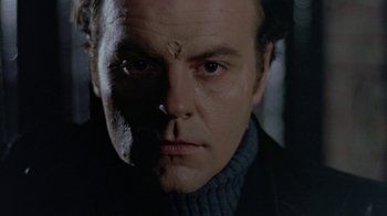 Movie still from “Scanners” (1981), directed by David Cronenberg – A person wearing a sweater; Close Up shot, Low angle