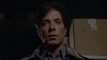 Movie still from “Scanners” (1981), directed by David Cronenberg – A person wearing a jacket; Close Up shot, Low angle