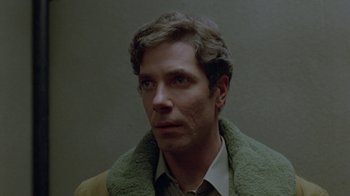 Movie still from “Scanners” (1981), directed by David Cronenberg – A person wearing a jacket; Close Up shot, Low angle