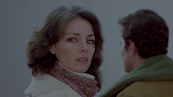 Movie still from “Scanners” (1981), directed by David Cronenberg – A person wearing a scarf; Close Up shot, Over the shoulder angle