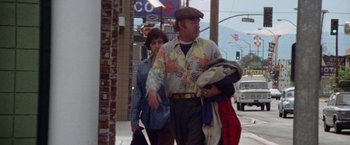 Movie still from “Scarecrow” (1973), directed by Jerry Schatzberg – A man and a woman walking down a street; Medium shot, Low angle