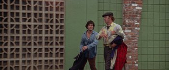 Movie still from “Scarecrow” (1973), directed by Jerry Schatzberg – Two men are standing next to each other; Wide shot, Low angle