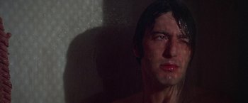 Movie still from “Scarecrow” (1973), directed by Jerry Schatzberg – A man's face in the shower; Close Up shot, Low angle