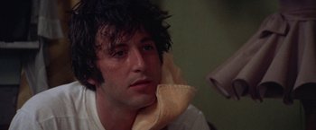 Movie still from “Scarecrow” (1973), directed by Jerry Schatzberg – A person holding a towel; Close Up shot, Low angle