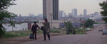 Movie still from “Scarecrow” (1973), directed by Jerry Schatzberg – A man and woman walking down a street; Extreme Wide shot, Over the shoulder angle