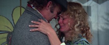 Movie still from “Scarecrow” (1973), directed by Jerry Schatzberg – A man and a woman embracing each other; Close Up shot, Over the shoulder angle