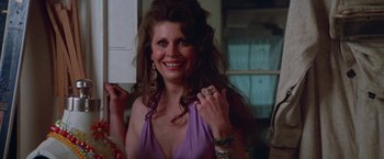 Movie still from “Scarecrow” (1973), directed by Jerry Schatzberg – A woman in a purple dress smiling for the camera; Close Up shot, Low angle